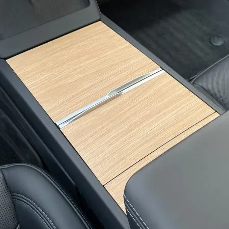 Wood grain style vinyl wrap on Tesla center console for Model 3 and Y