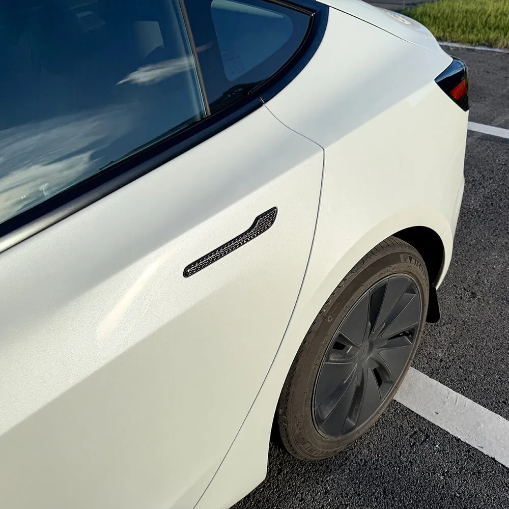 Black carbon fiber door handle trim installed on Tesla Model 3